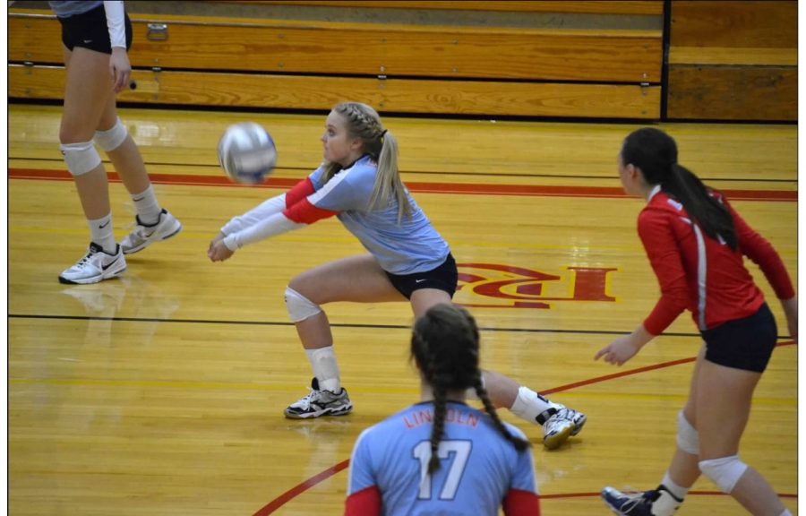 Freshman Somer Luitjens passes the ball in a game against RHS.