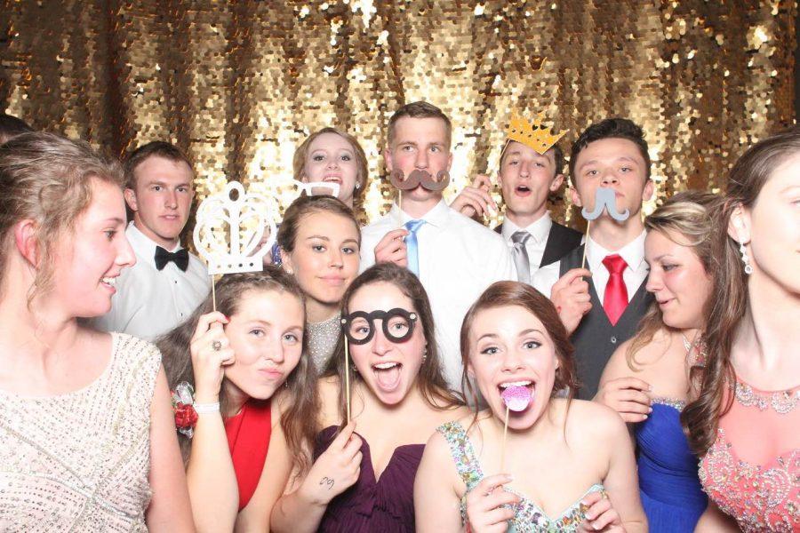 The phtobooth at the El Riad Shrine was occupied throughout the whole dance by prom attendees who were smiling, jumping and using various props. 
