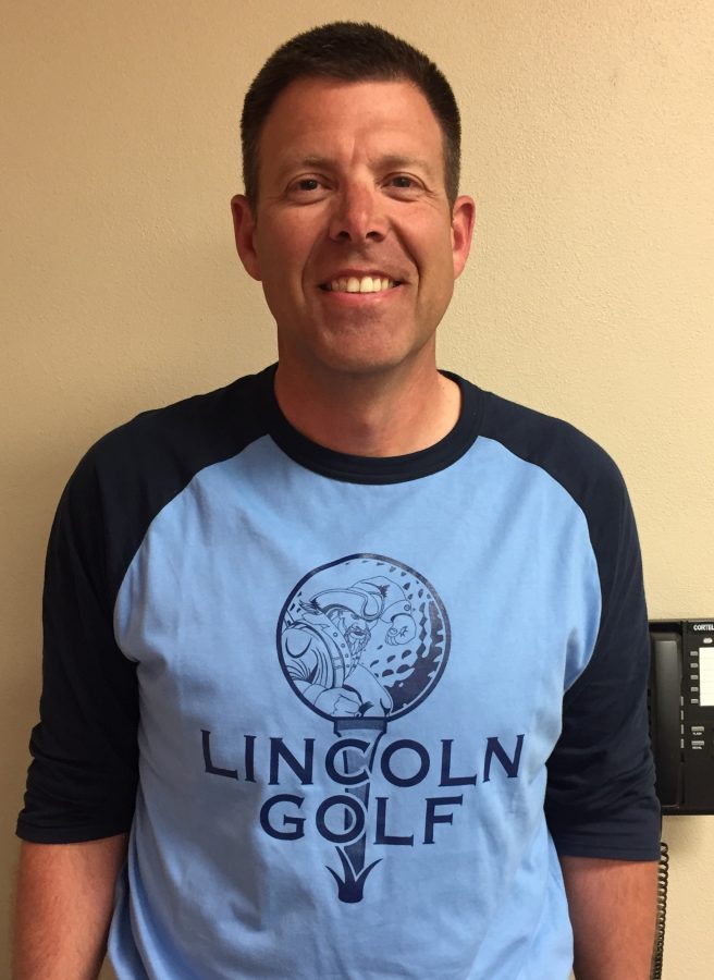 This pictures Scott Amundson sporting a LHS golf shirt as the head coach of the girls team.