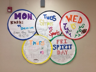 Posters hung in the theme of Olympic rings for homecoming week 