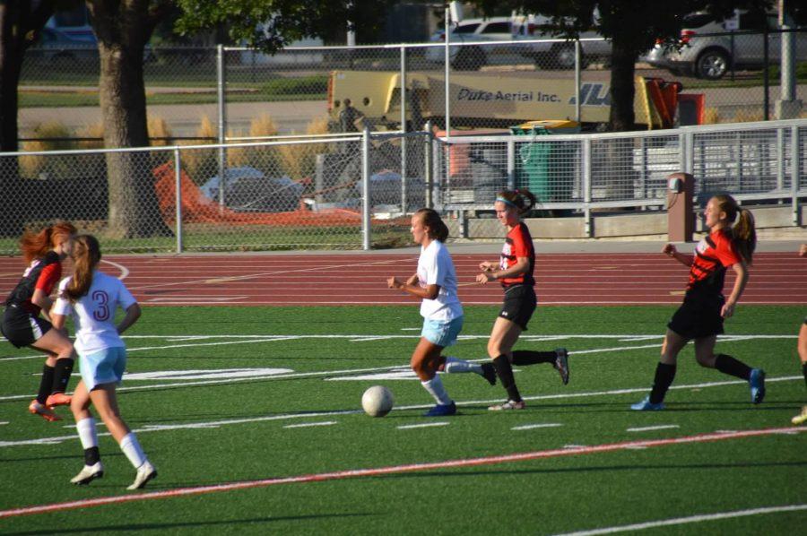 Landon, pictured here in LHS soccer teams game against Brookings, makes a run for the goal right before she scored. Landon would finish the game with a hat trick, and the pats would end up winning 4-2.