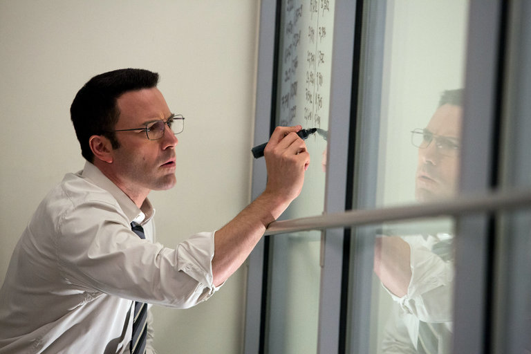 Christian Wolff, the Accountant, draws on whiteboards and windows to try and figure out where $61 million was missing from Living Robotics.