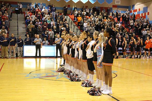 LHS and WHS cheerleaders stand during the national anthem at the LHS vs WHS basketball game on Jan. 26.