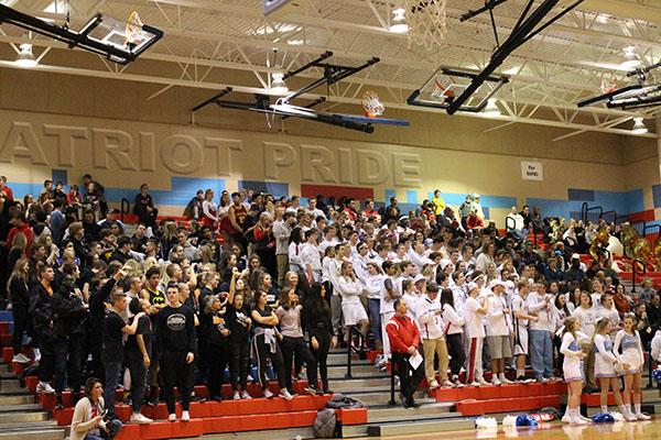LHS and WHS student sections cheering on their respective basketball teams at the LHS vs WHS basketball game on Jan. 26.