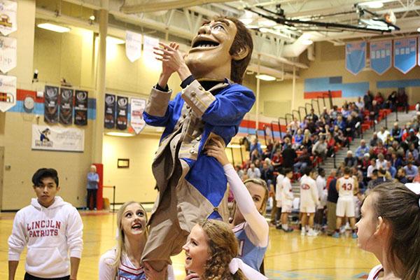 The LHS cheerleaders get Murphy involved in the cheers during the LHS vs WHS basketball game on Jan. 26.