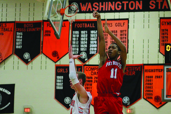 Christophe Bwanya goes up for shot during the fourth quarter of the LHS vs. WHS boys basketball game.