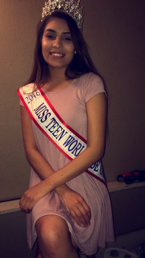 Sophomore Marks poses for a picture in her Miss Teen Worldwide United crown and sash.