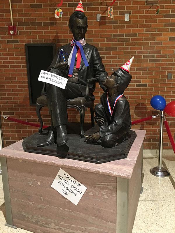 Statue of Abe Lincoln decorated in honor of his 208th birthday
