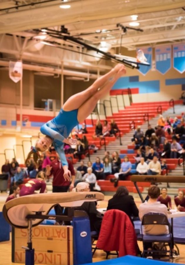 Hart competes on vault during the Metro Conference gymnastics meet.