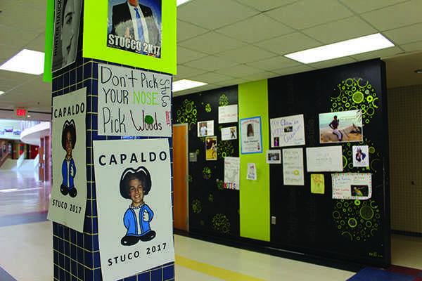 Students begin to hang posters around the school as they run for the upcoming Student Council election.