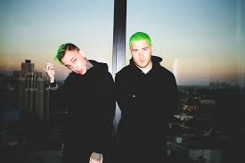 Posner and blackbear pose with their neon green hair.