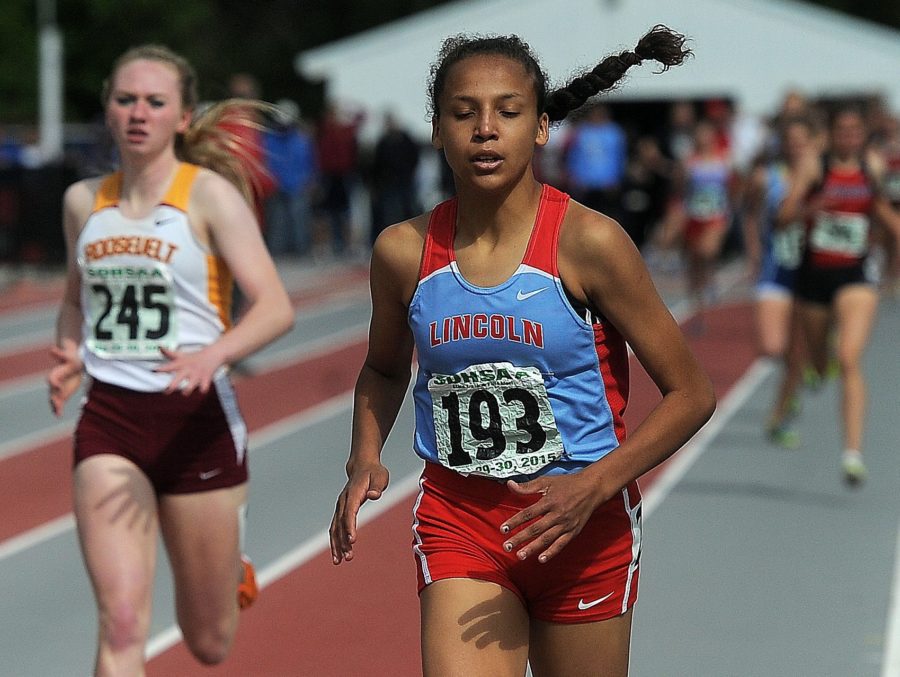 Jasmyne Cooper is sprinting to the finish of a race from a meet during the 2016 season.