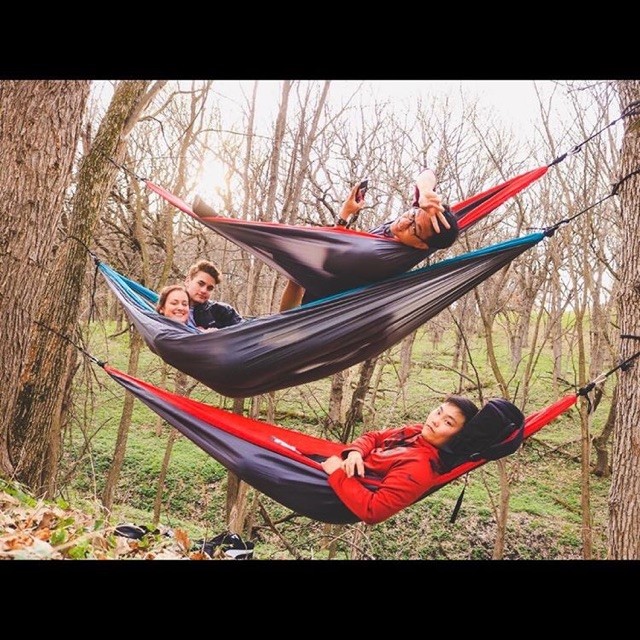 Senior Hannah Best stacks hammocks with friends from WHS earlier this spring.