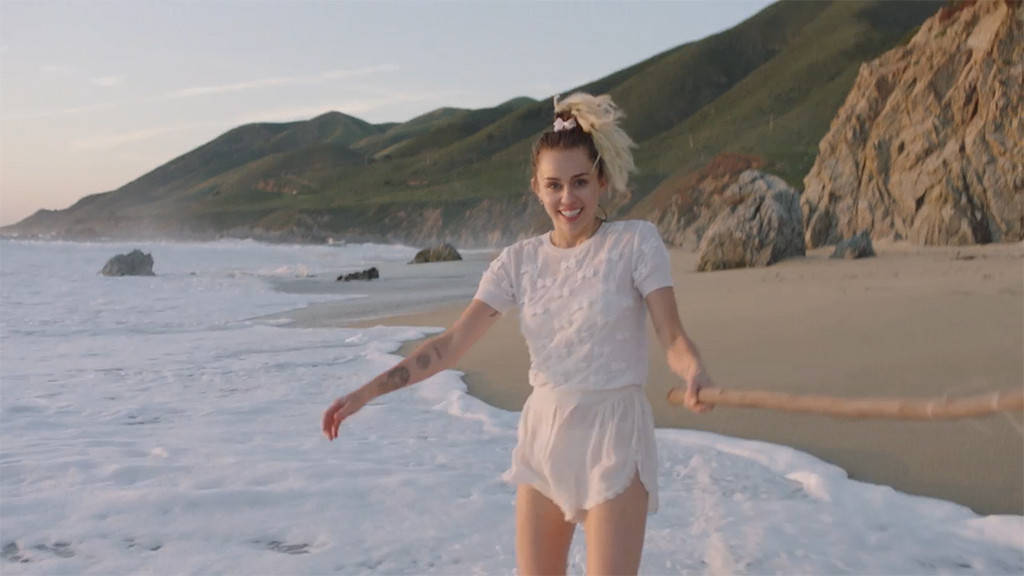 Cyrus has a light spirit in her music video for her new single.