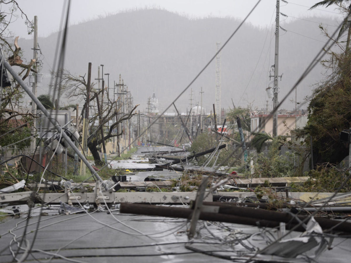 Electricity poles and power lines toppled by Hurricane Maria are seen in Humacao, Puerto Rico, Wednesday. The storm left the island without electricity service, officials say.