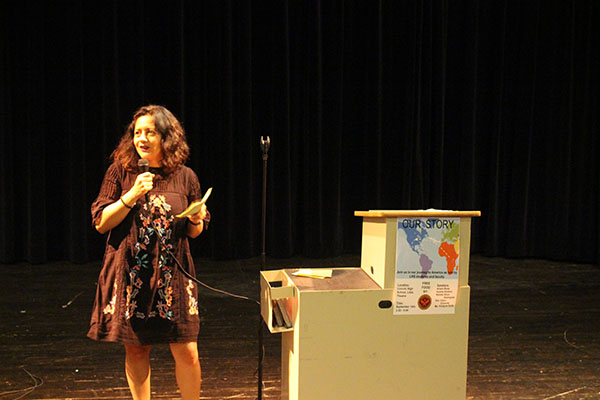 Monica Conover tells her story in the little theater on Thursday after school.
