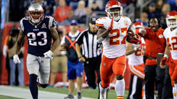 Hunt runs down the sideline during week one's game: Chiefs versus the Patriots.