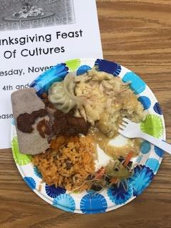 A plate of food from the Thanksgiving Feast of Cultures containing food from different countries.