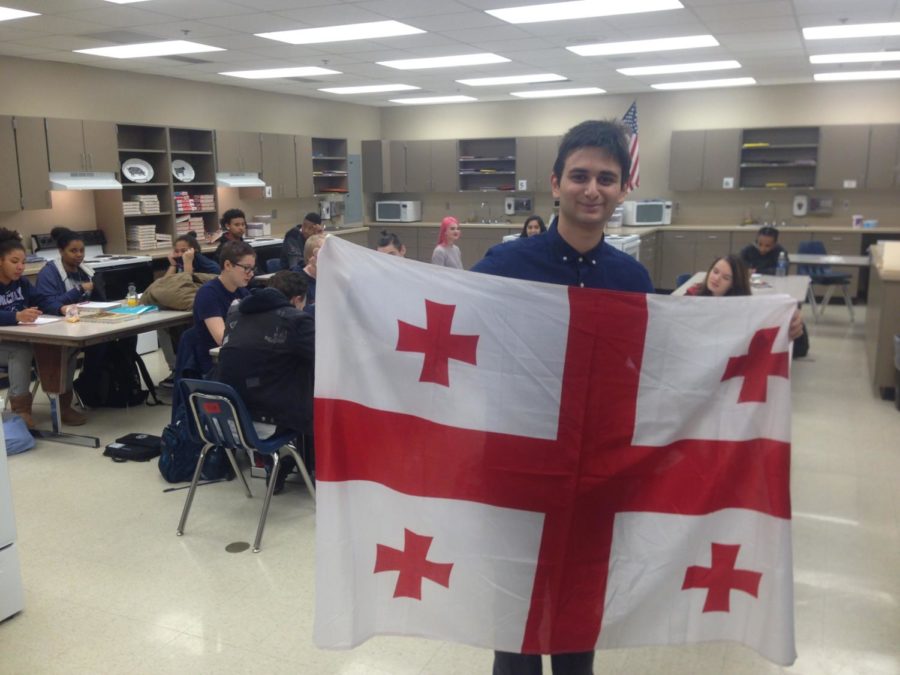 Daviti Revazishvili posing with his countries flag.