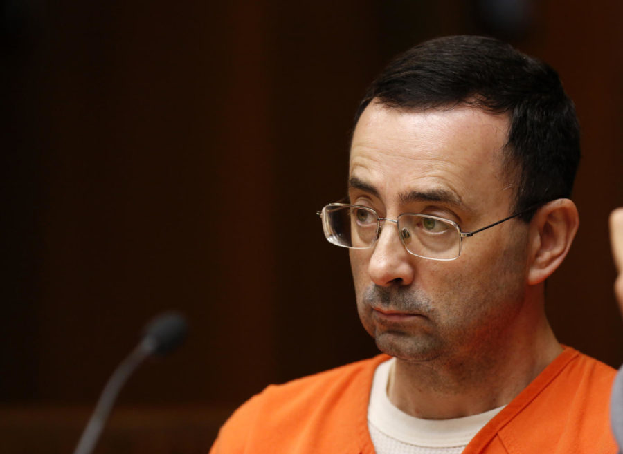 Former Michigan State University and USA Gymnastics doctor Larry Nassar is seen in the 55th District Court where Judge Donald Allen Jr. bound him over on June 23, 2017 in Mason, Michigan to stand trial on 12 counts of first-degree criminal sexual conduct. / AFP PHOTO / JEFF KOWALSKY        (Photo credit should read JEFF KOWALSKY/AFP/Getty Images)