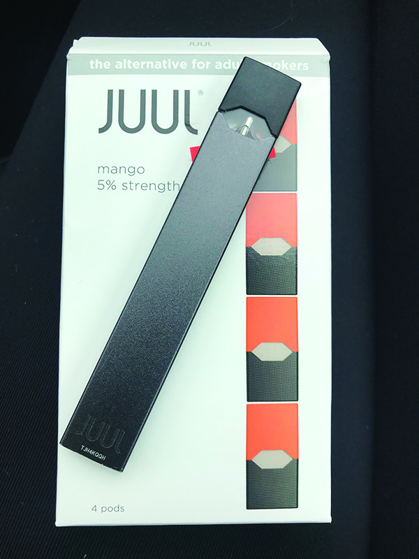 Juuls+come+in+different+colors+and+pods+come+in+different+flavors+like+mango+and+and+tobacco.+