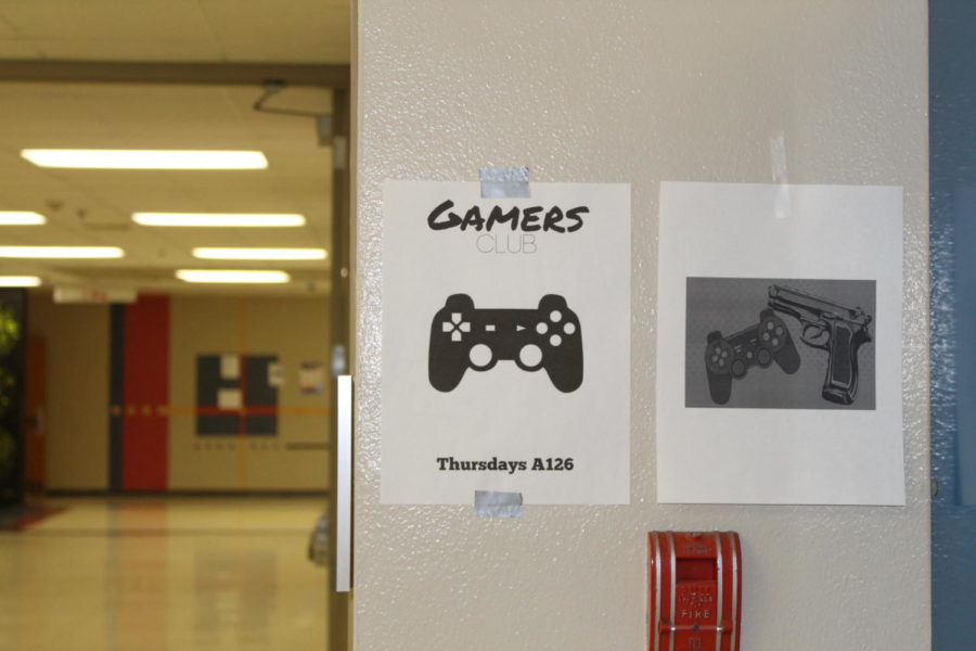 A friendly reminder from the Gamers club at LHS next to a photo that characterizes how some feel about violent video games. 