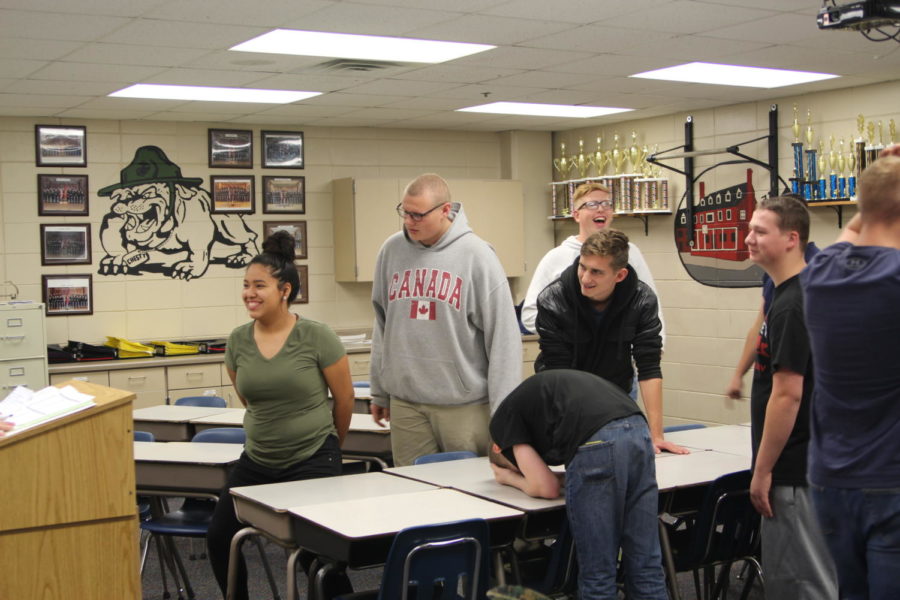 Students in the JROTC program participate in a review game of Family Fued.