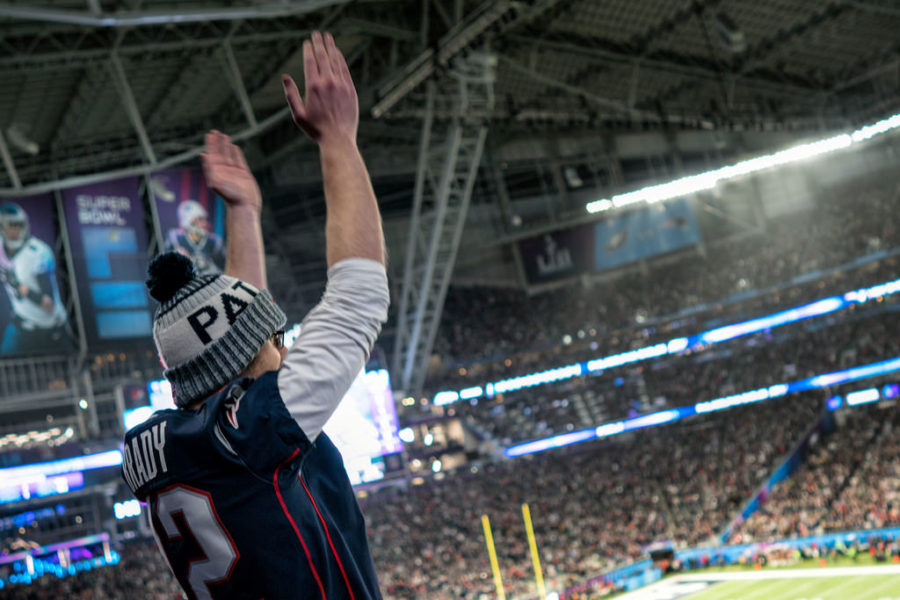A Patriots fan celebrates a touchdown at the Super Bowl LII