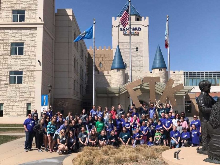 Participants of the Augiethon stand together in front of the Sanford Childrens Hospital for the Childrens Miracle Network fundraising event in April.