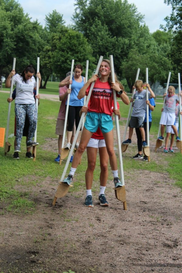 Lila Batcheller competing on stilts with her partner during last summer's "Great Amazing Race." The "Great Amazing Race" was last year's version of the President's Bowl 5k. 