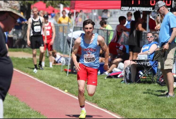 LHS junior Hunter Merkley runs up before attempting a jump at a meet.