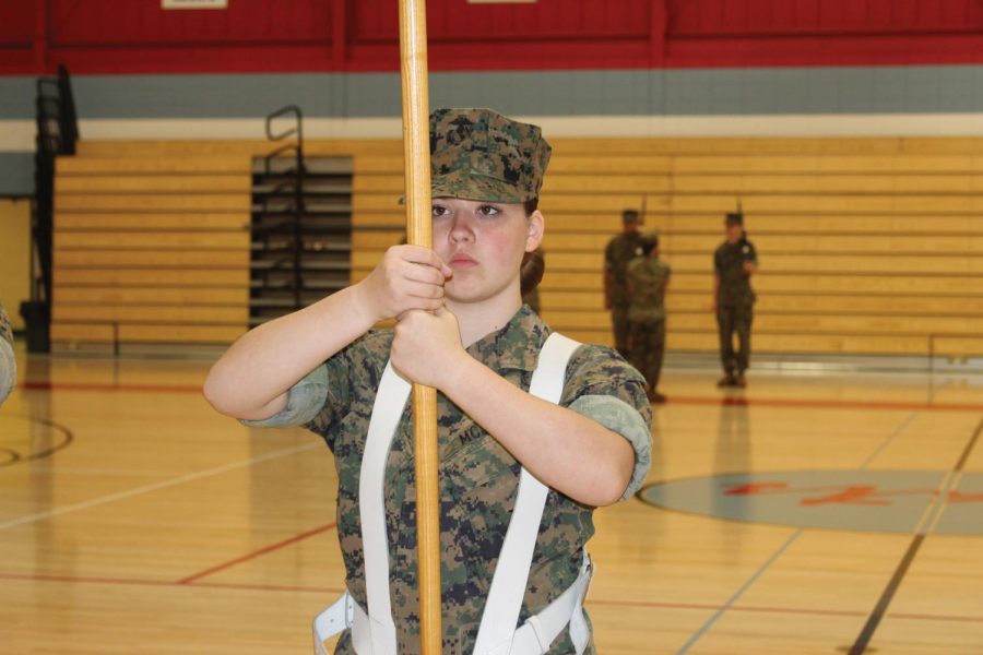 Cadet Jaquie Tarbox attends a color guard practice in the old gym of LHS. 