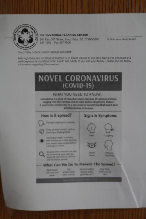 An informational flyer about coronavirus posted in between the administration doors.