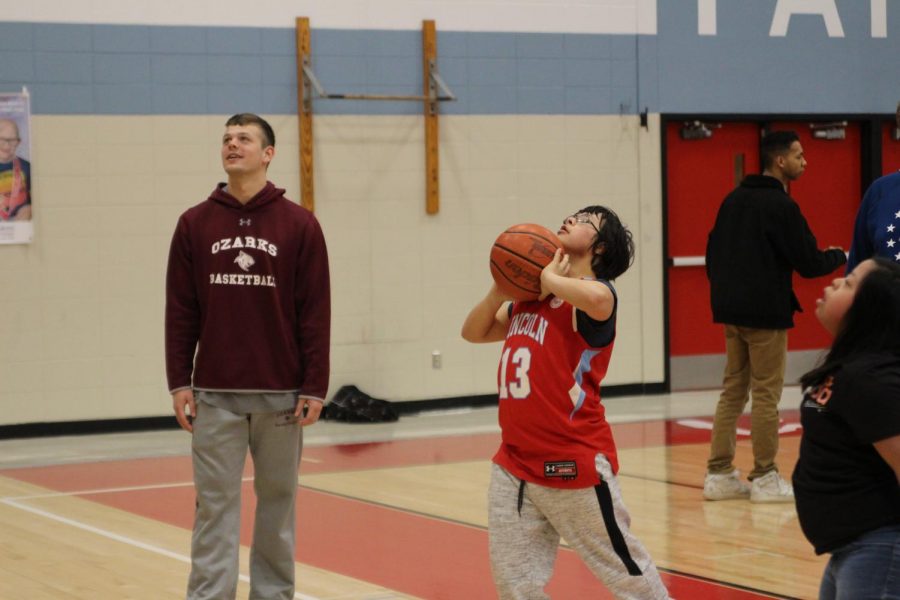 Dax Huezo-Vargas shoots with College of the Ozarks junior Trey Gibson on Tuesday, Mar. 10.