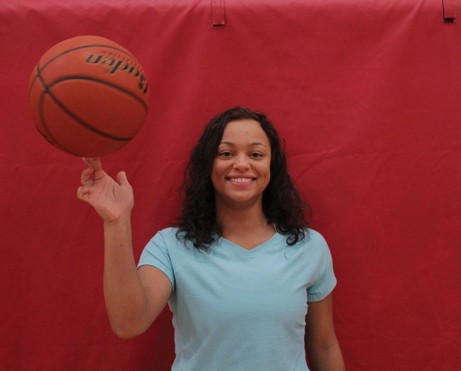 LHS Senior Mya Wilson showcasing her basketball skills.