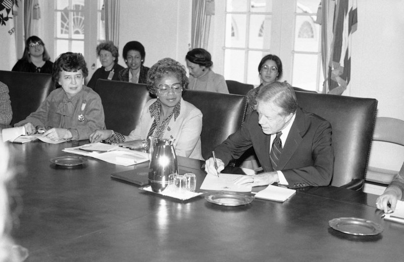 President Jimmy Carter signs document at the White House in Washington proclaiming March 2-8  is"National Women's History Week."