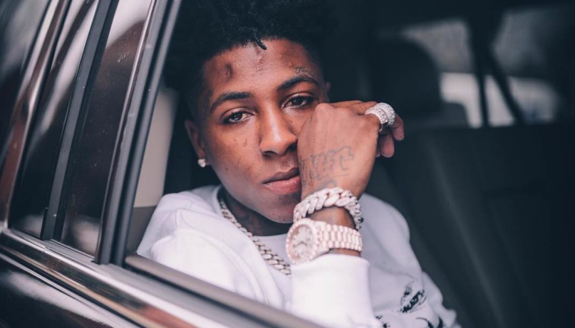 Youngboy Never Broke Again casually in his car with all diamond jewelry. 