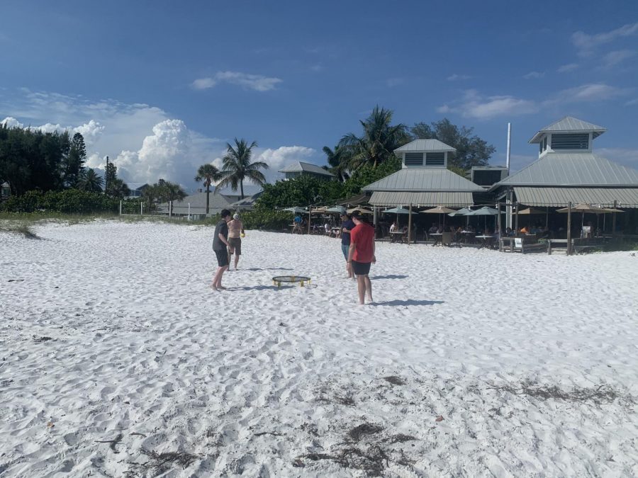 My brothers, my dad and I playing Spikeball on the beach in Florida.