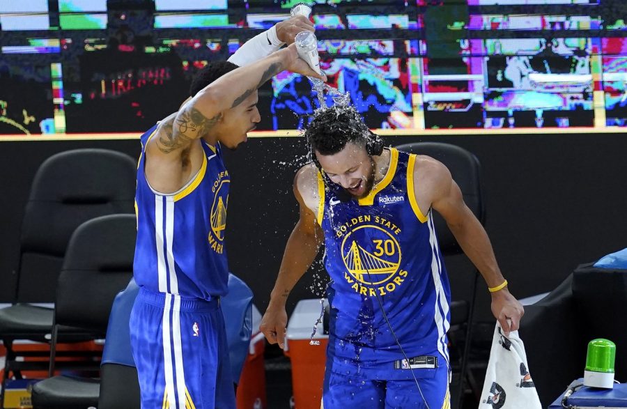 Juan Toscano-Anderson pours water on Stephen Curry after a career night.
