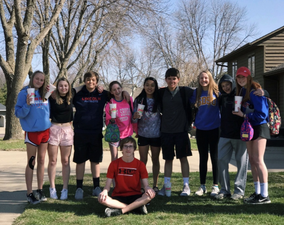 With friends waiting at the bus stop in 8th grade on the day of a late start.