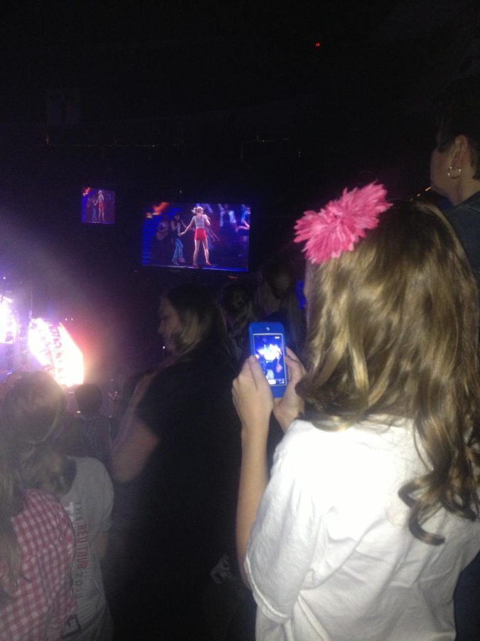 Third grade Olivia admiring the one and the only Taylor Swift, at her 2013 Red tour. 