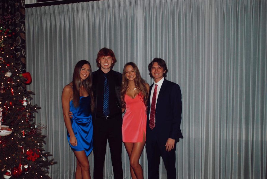 Four+friends+pose+for+the+camera+at+the+2021+LHS+Winter+Formal.%0A