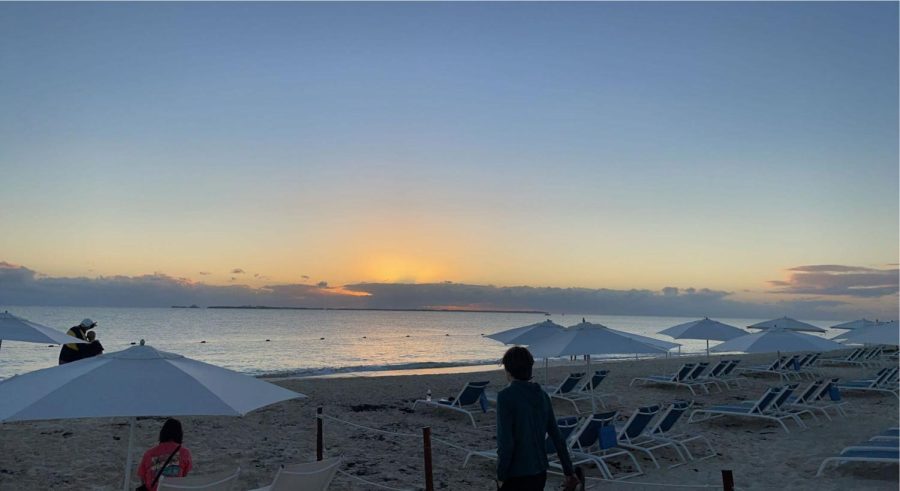 Photo taken of the Cancun sunrise while walking on the beach with family.