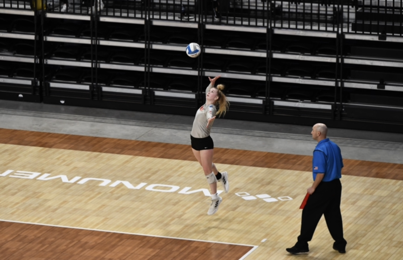 Freshman, Taryn Kirsch playing the game she loves. One of her volleyball games in 2021. 
