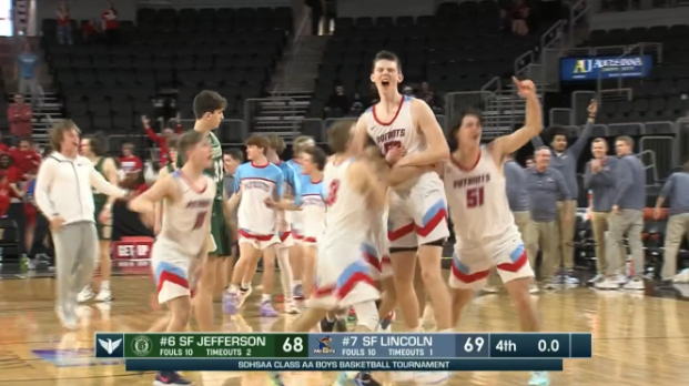 JT Rock and the Patriots celebrating after his buzzer beater shot at the State tournament