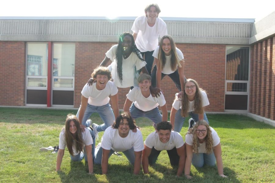 LHS homecoming royalty bonds through taking a pyramid picture in front of the school!