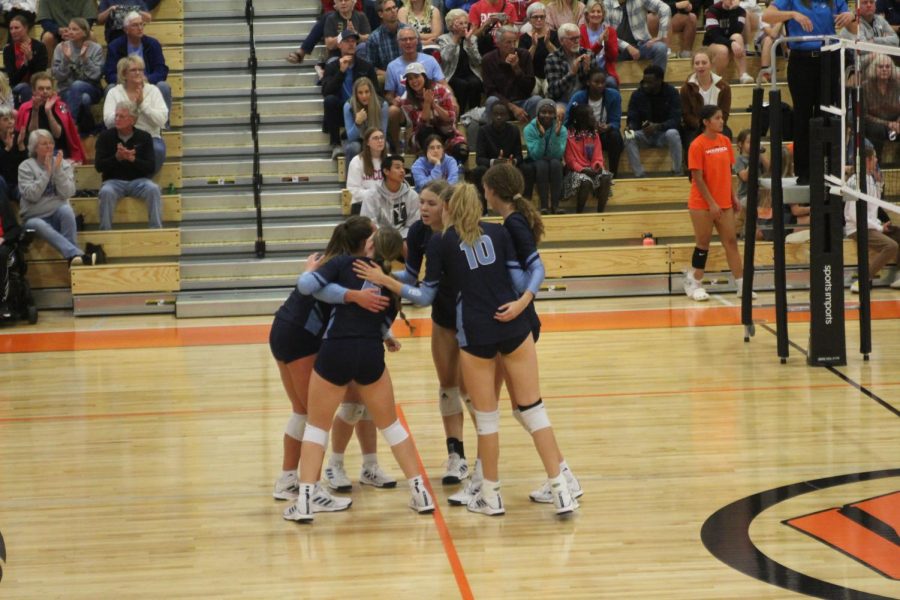 LHS players cheer each-other on mid-match against WHS.