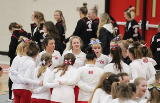 The LHS gymnastics girls hyping each other up before a big meet. 
