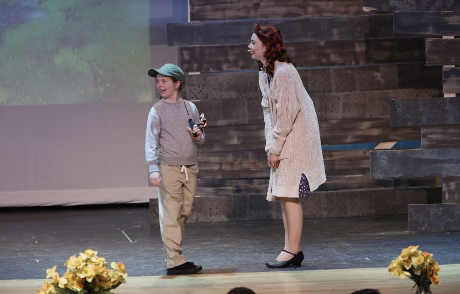 Sandra Bloom, played by Elsa Friesen, earnestly talks to her grandson about his first time fishing.