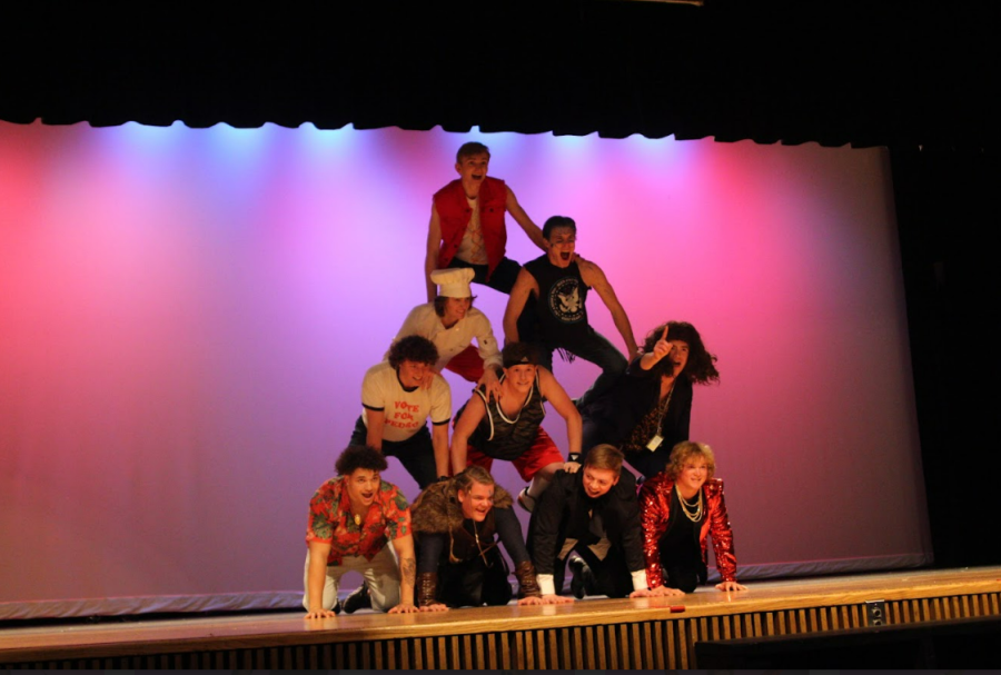 Mr. LHS candidates making a human pyramid at the end of their dance performance.